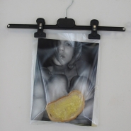My Five Minutes, 2007, installation (7×: photo 21 × 29,7 cm, see-through envelope, clothes hanger, slice of bread, honey, butter, nail)